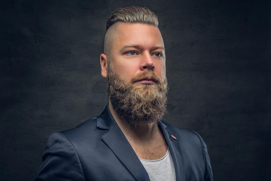 brutal-bearded-male-violet-jacket-isolated-with-contrast-illumination-grey-background_613910-1950