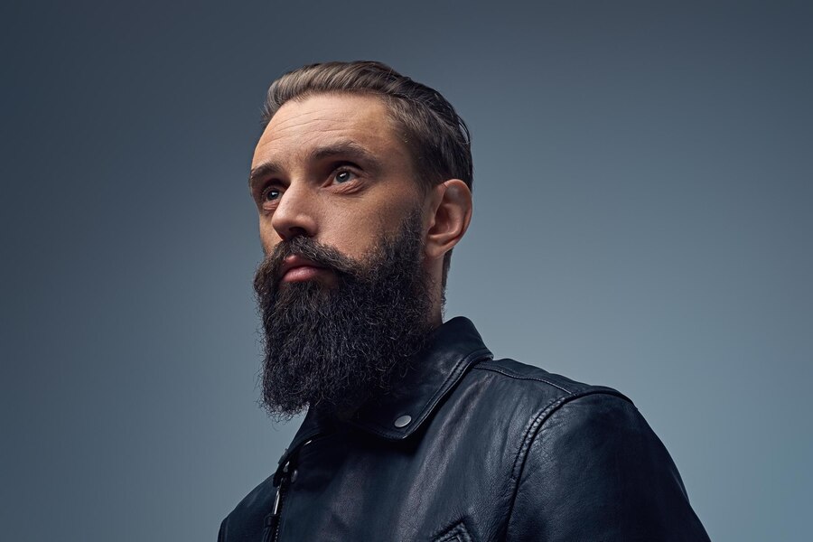 studio-portrait-bearded-male-dressed-black-leather-jacket_613910-2790